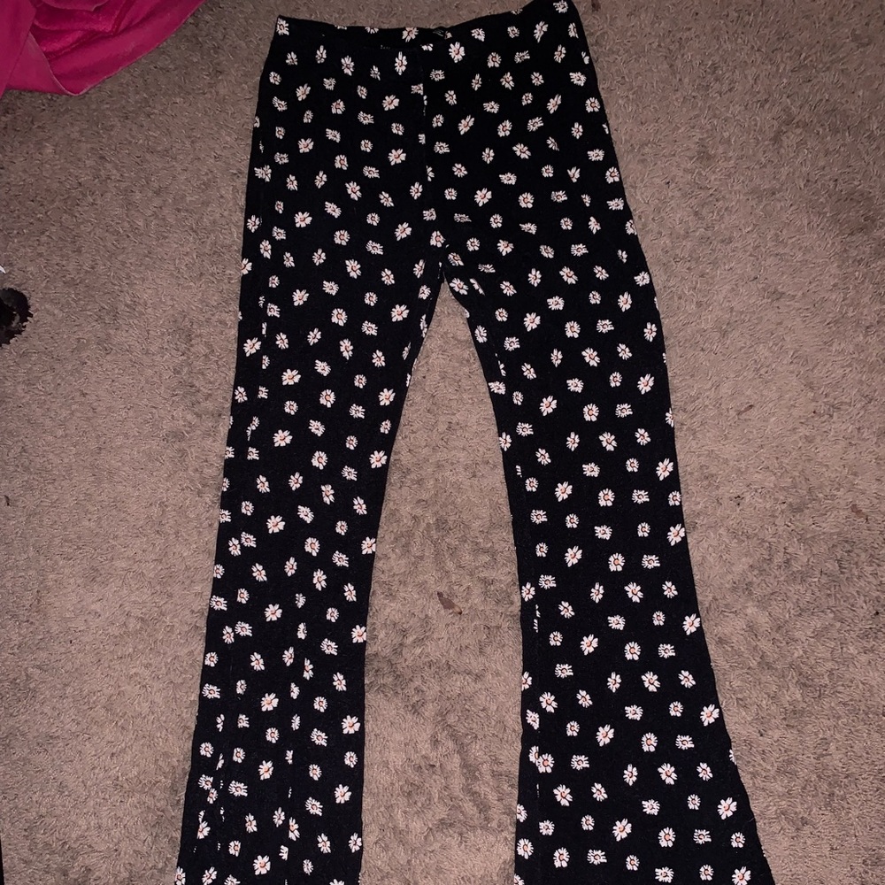 Black flower bell bottom leggings.